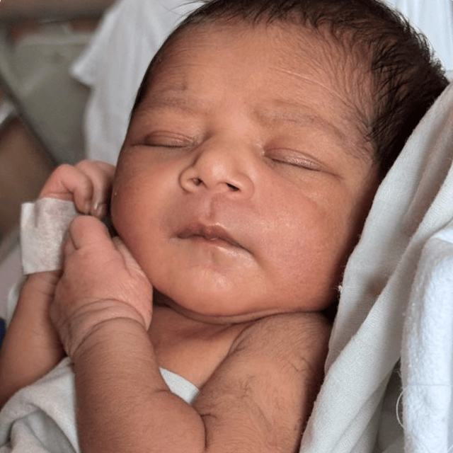 An baby from India sleeps soundly in the hospital.