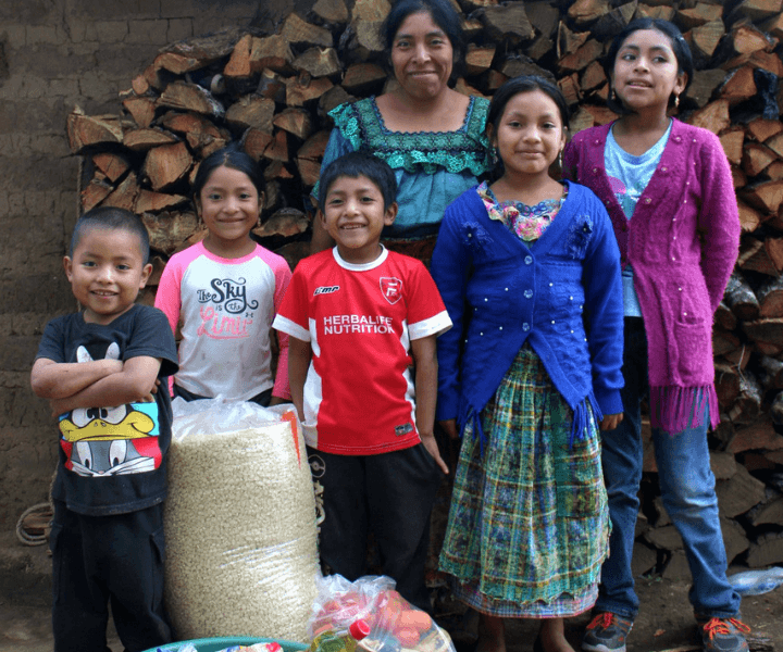 A Guatemalan family in LWB's Nutrition Program receives food.
